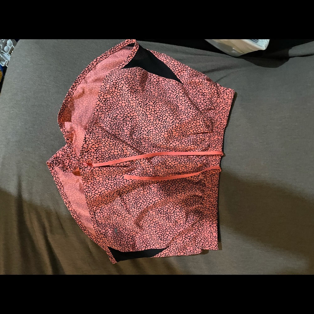 Medium Pink/black Nike print running shorts. Barely worn. Selling for $15.